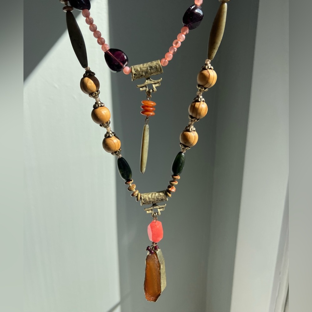 Trespass necklace with glass, wood, and geode.